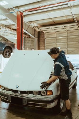 Technician working on a BMW at Blueline Automotive